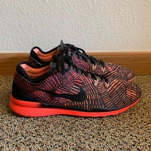 Nike Women's Black and Orange Patterned Sneakers